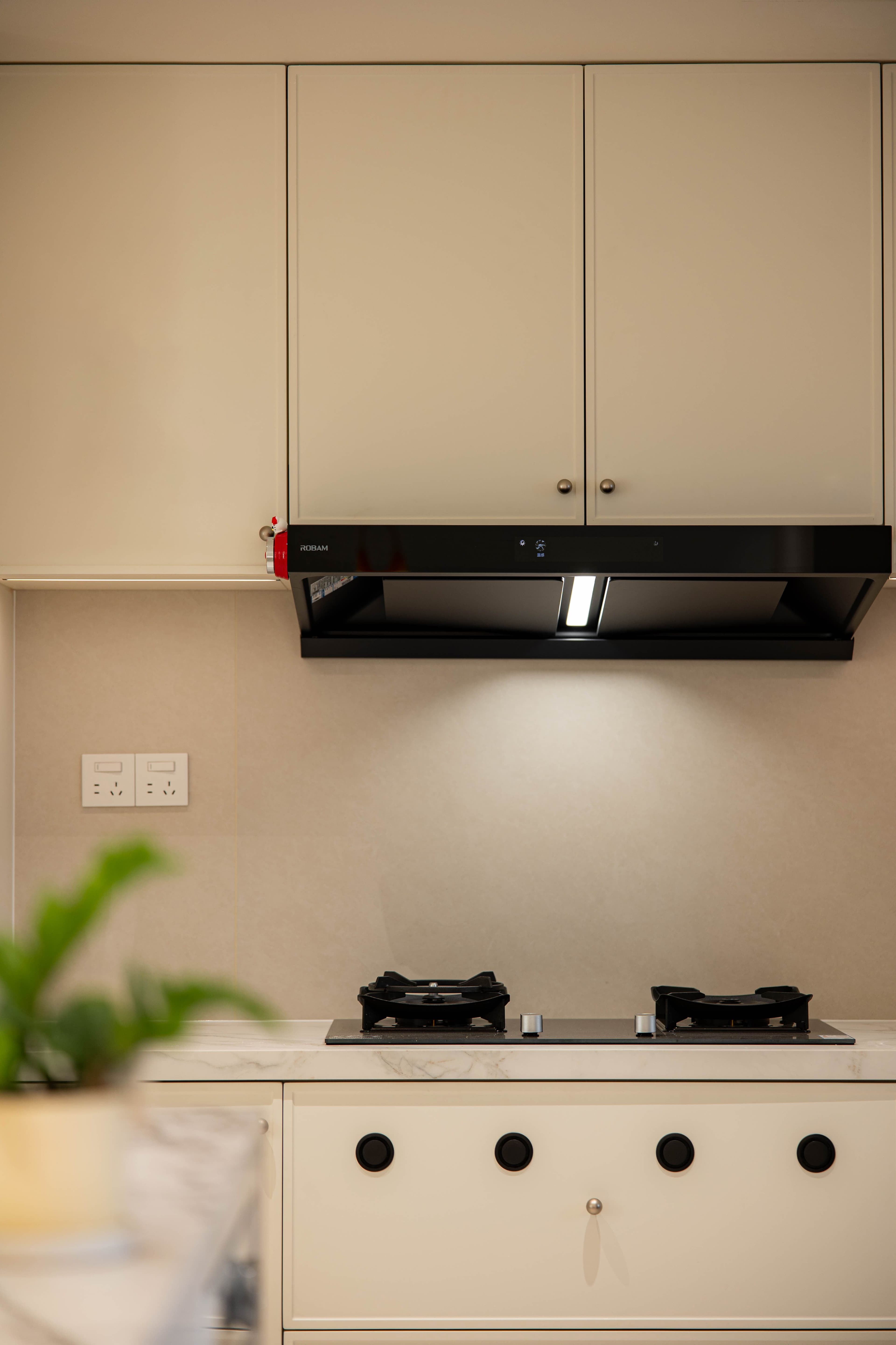 Architectural material detail featuring warm natural oak veneer, quartzite stone, and precision joinery